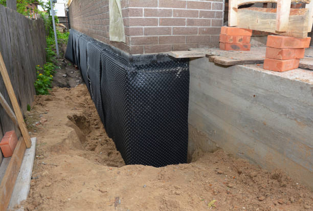 Happy homeowners after waterproofing job in Champlin
